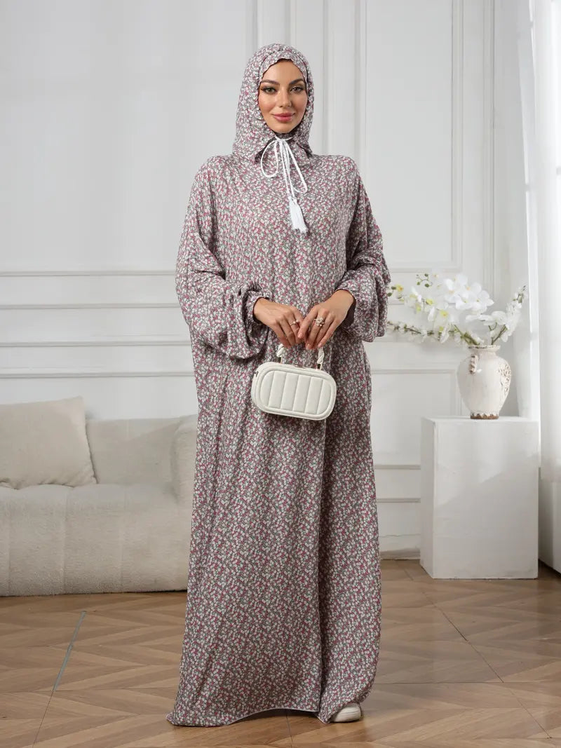 Plus-Size Fashion Floral Dress with Hood and Drawstring — featuring a loose fit, long lantern sleeves, and a modest yet casual style.